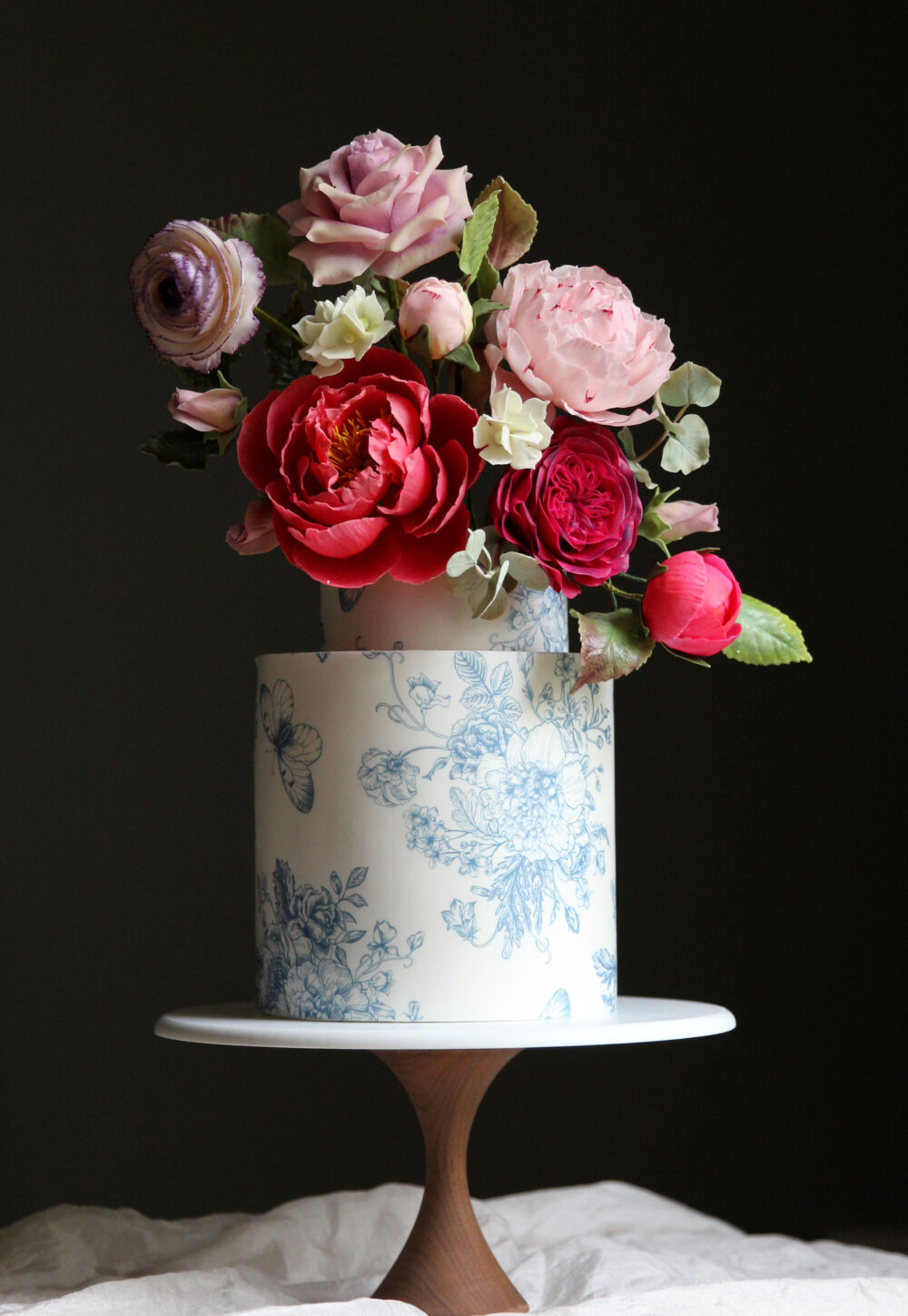 Vibrant sugar flower wedding cake Cove Cake Design