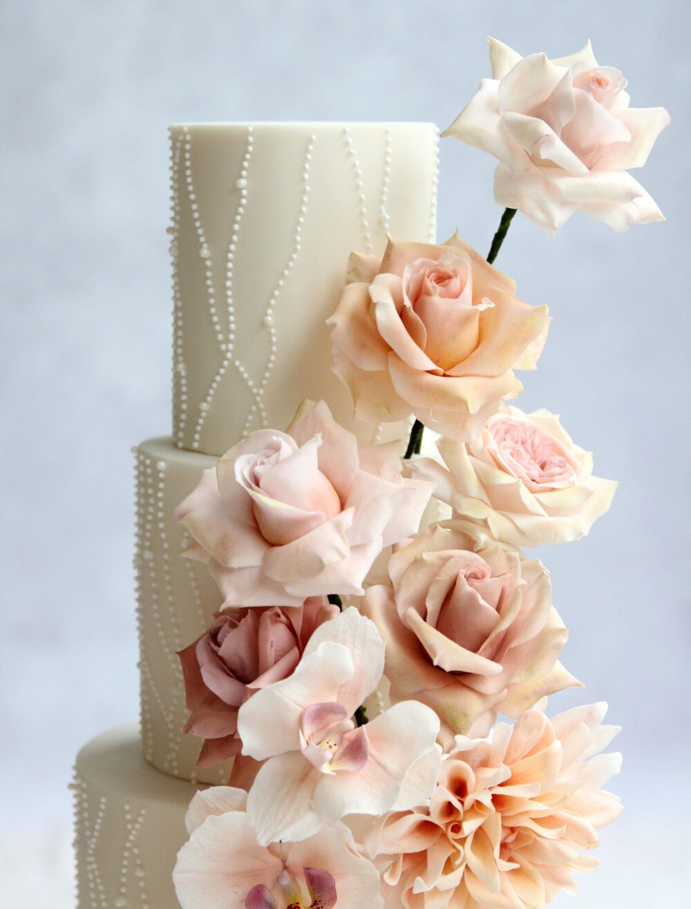 Pastel sugar flowers wedding cake Cove Cake Design