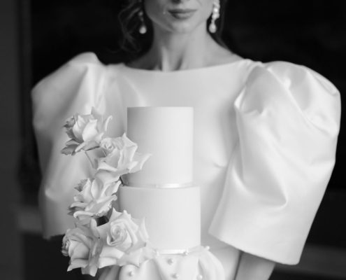 White wedding cake with sugar roses