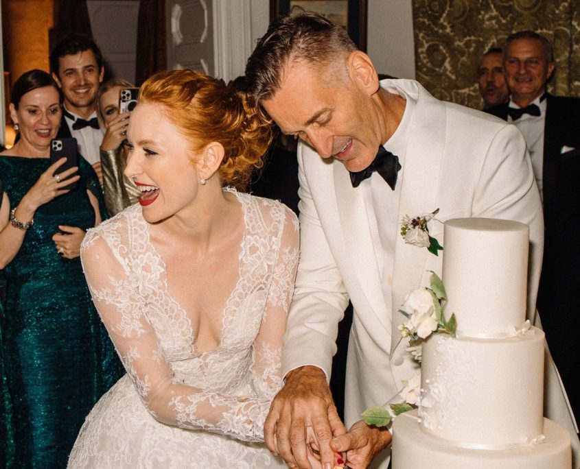 Bride and groom cutting the cake