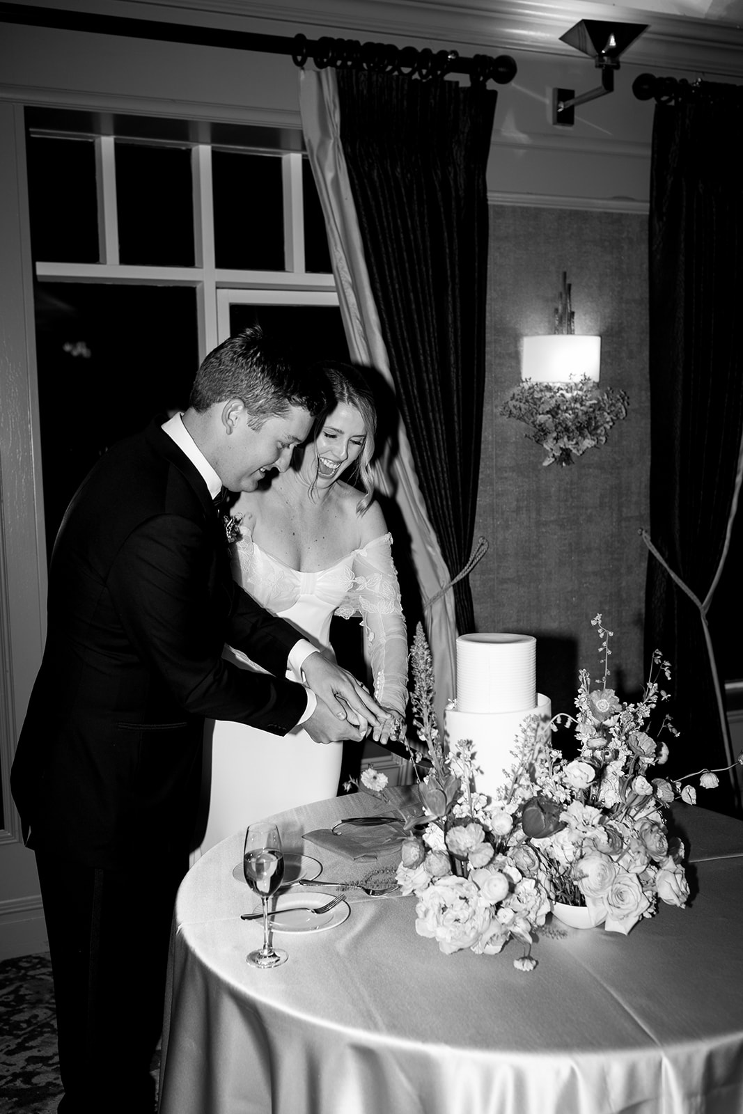 Couple cutting wedding cake