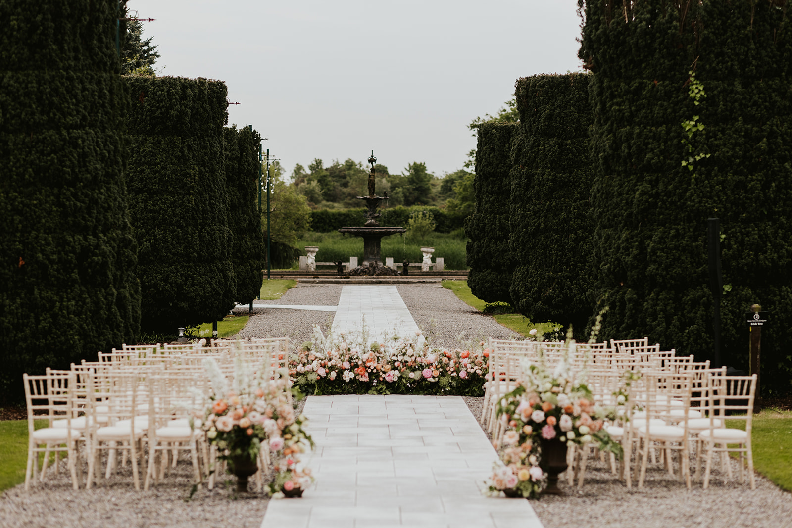 Outdoor wedding set up with beautiful aisle florals